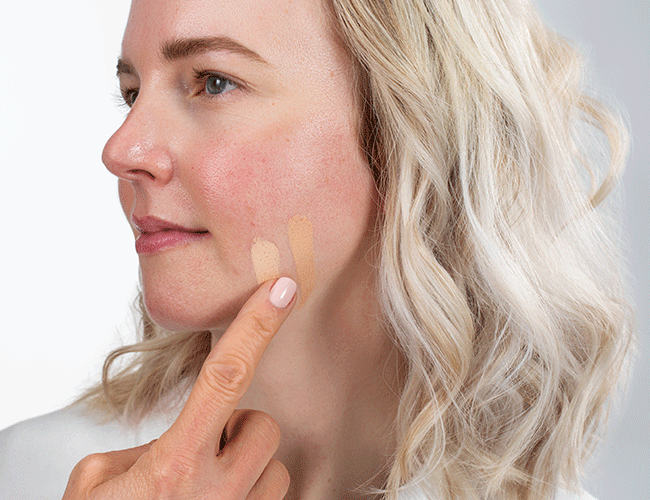 A lighter and darker shade of Camouflage Cream is applied